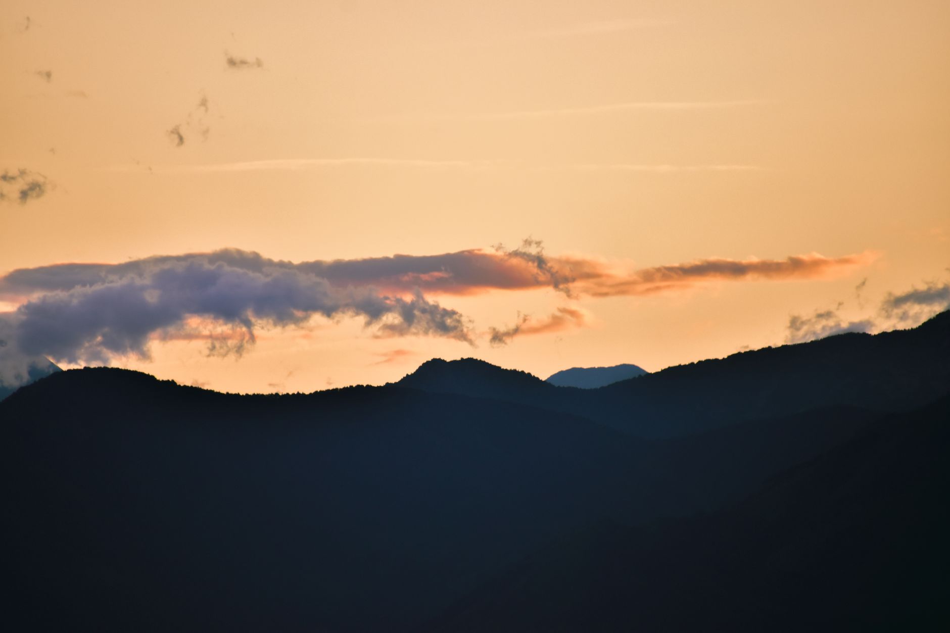 Mountains at golden hour, warm and hopeful