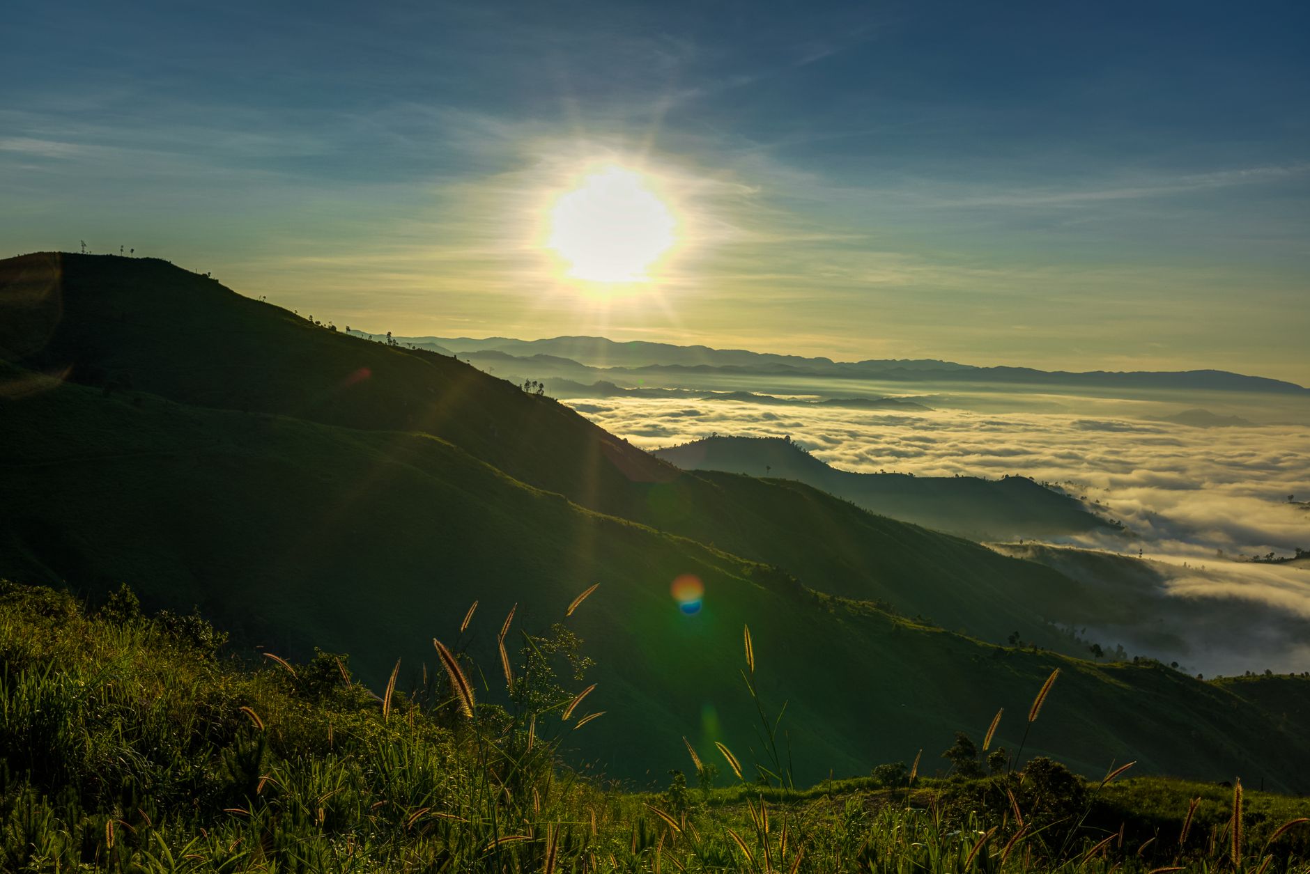 A bright mountain landscape at sunrise